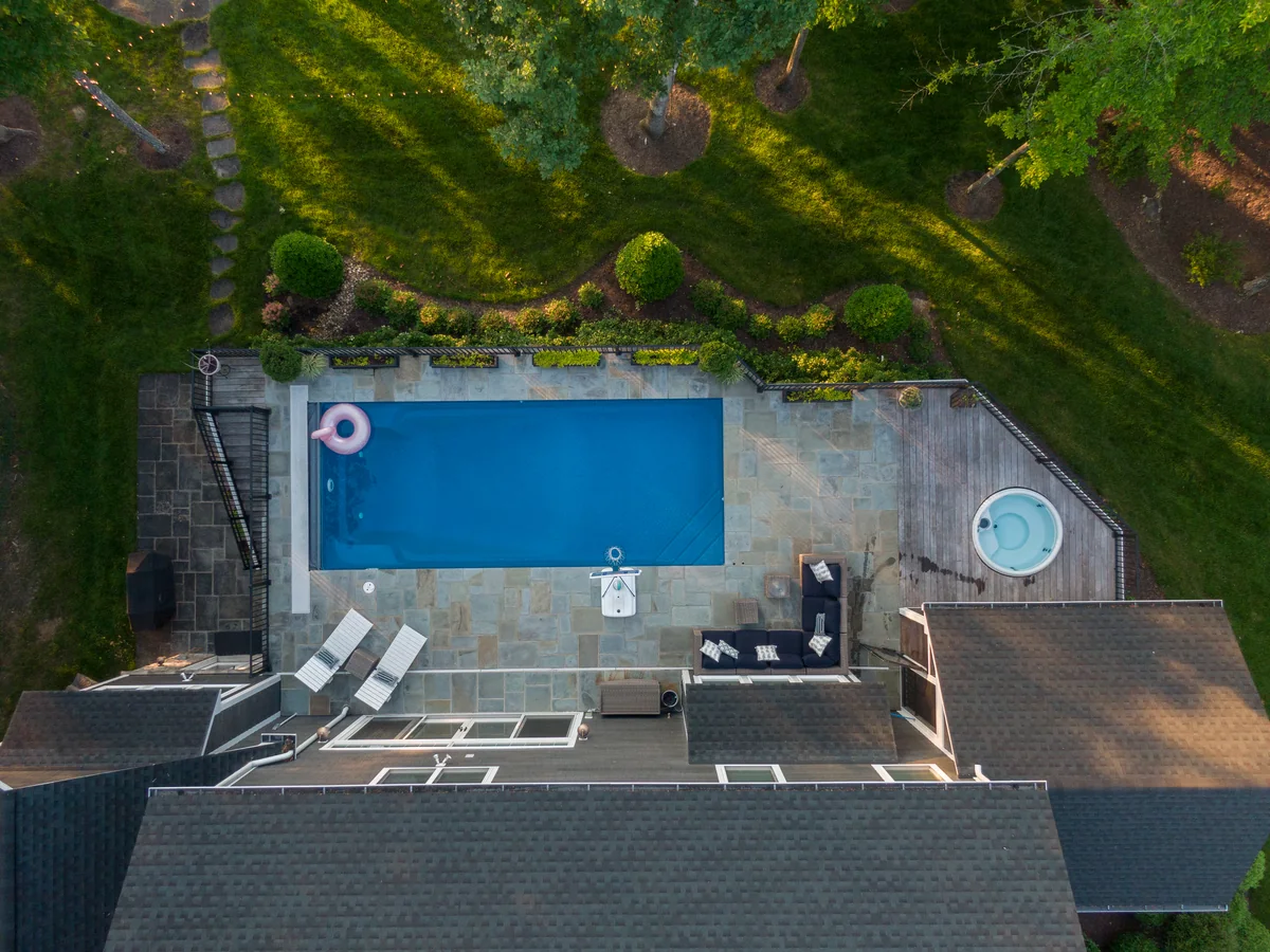 Overhead swimming pool and garden in evening light